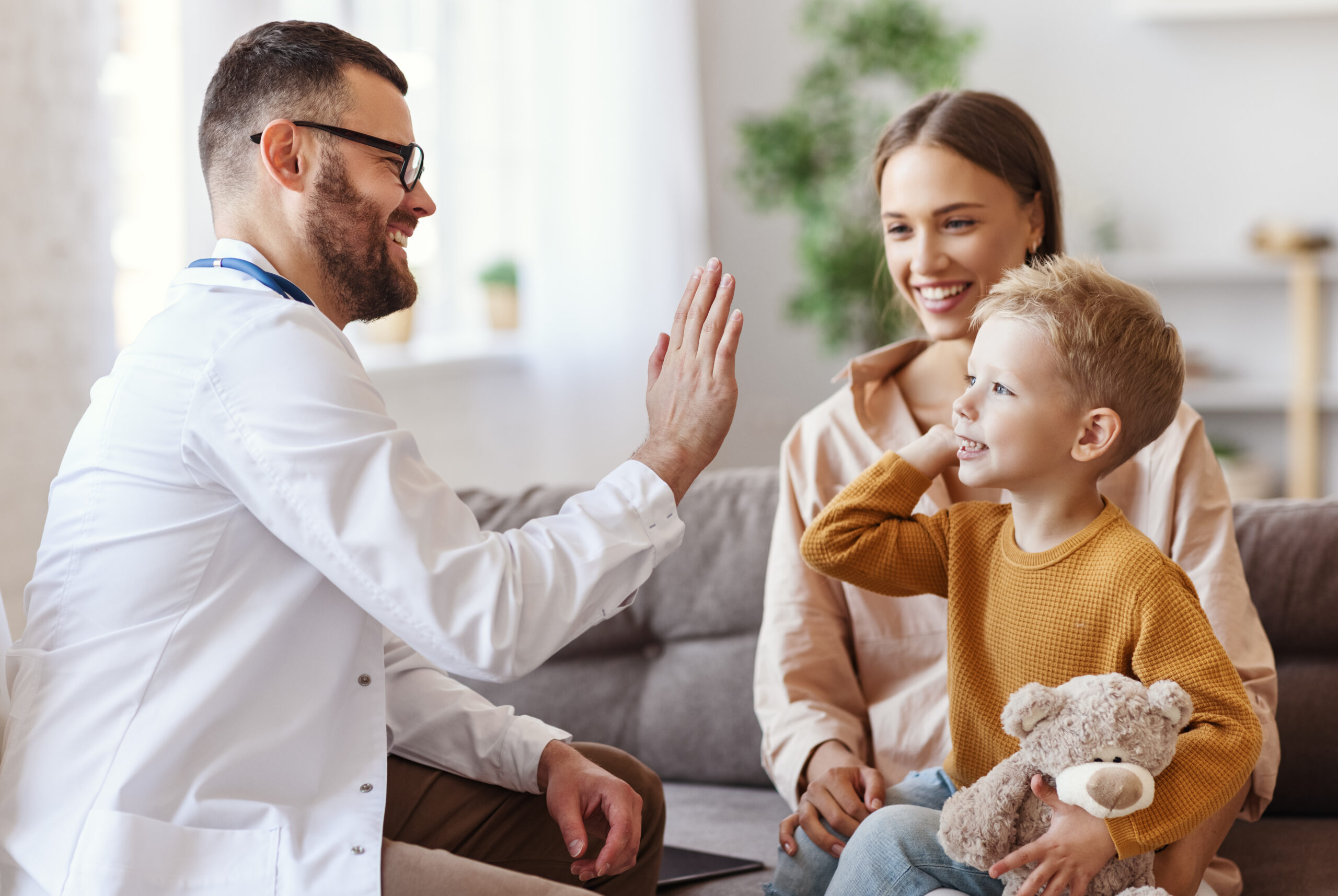 pediatric doctor examining a child